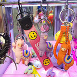 3 Lama keychain with bell hanging on a rod