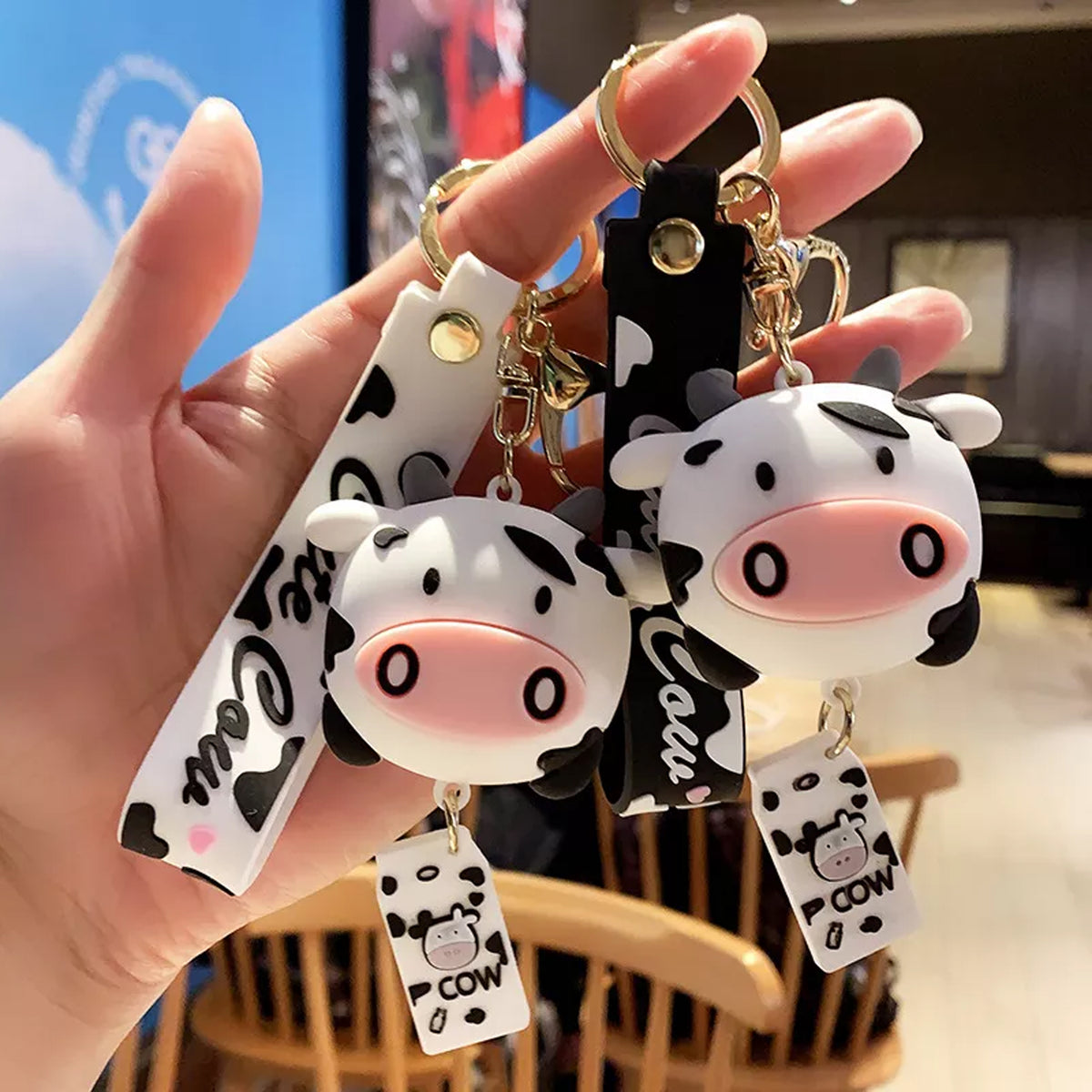 Two Cow keychain with strap