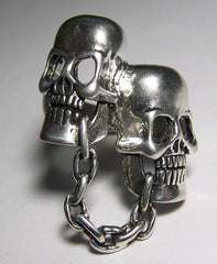 Wholesale CHAINED TOGETHER SKULL HEADS BIKER RING (Sold by the piece)