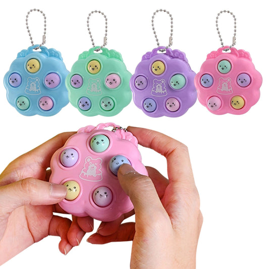 Four hamster game fidget toys with one in hand