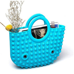 blue pop it fidget handbag filled with household items to demonstrate its usablitiy