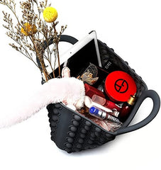 black pop it fidget handbag fully loaded with different items to show how much it can carry