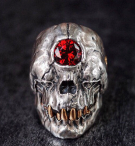 Wholesale EVIL MONSTER SKULL WITH RED JEWEL METAL BIKER RING (sold by the piece)