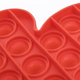 Close up view of Red Santa Gloves Pop it Fidget Toys